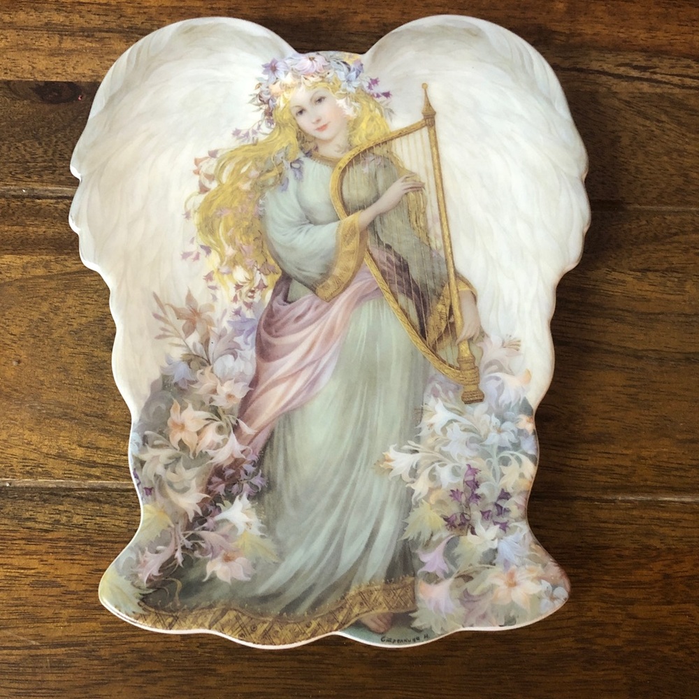 a 1997 Bradford Exchange "Serenity's Song" from the "A Symphony of Angels"